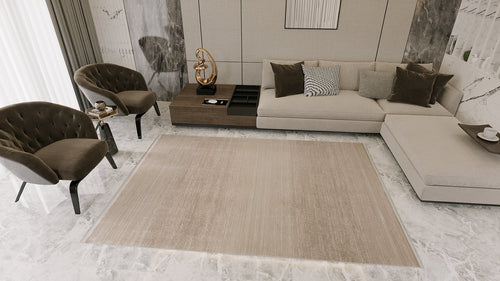 Load image 1 in gallery view. Modern living room with a beige sectional sofa, dark velvet armchairs, rectangular coffee table, marble floors and walls, decorative accents, and the Earthy Textures Neutral Rug - M497J. Natural light streams in from a large window.