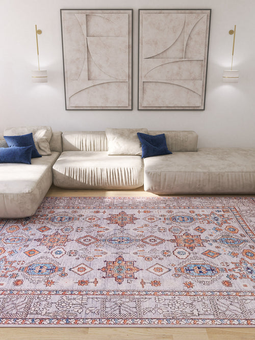 Bild 1 in Galerieansicht laden. A modern living room with a cream sectional sofa, blue pillows, the Echelon Bordered Washable Rug - LCC3018 in gray-anthracite for high-traffic areas, abstract wall art, and wall-mounted light fixtures.