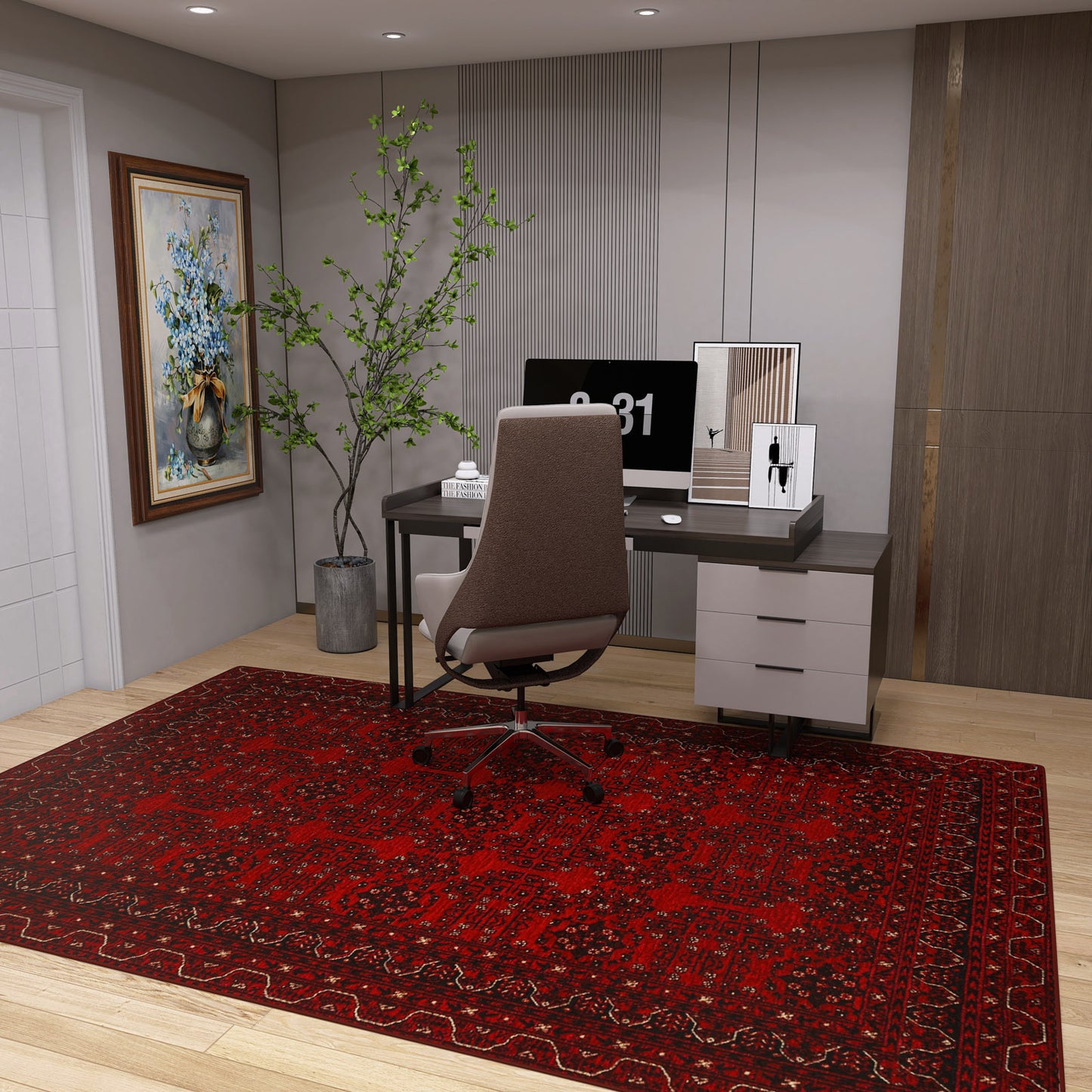 A modern home office with a desk, computer, and chair is arranged on the Ember Stitch - Washable Kilim - BHR02 rug. A potted plant, framed art, and decor enhance the neutral walls and wood flooring.