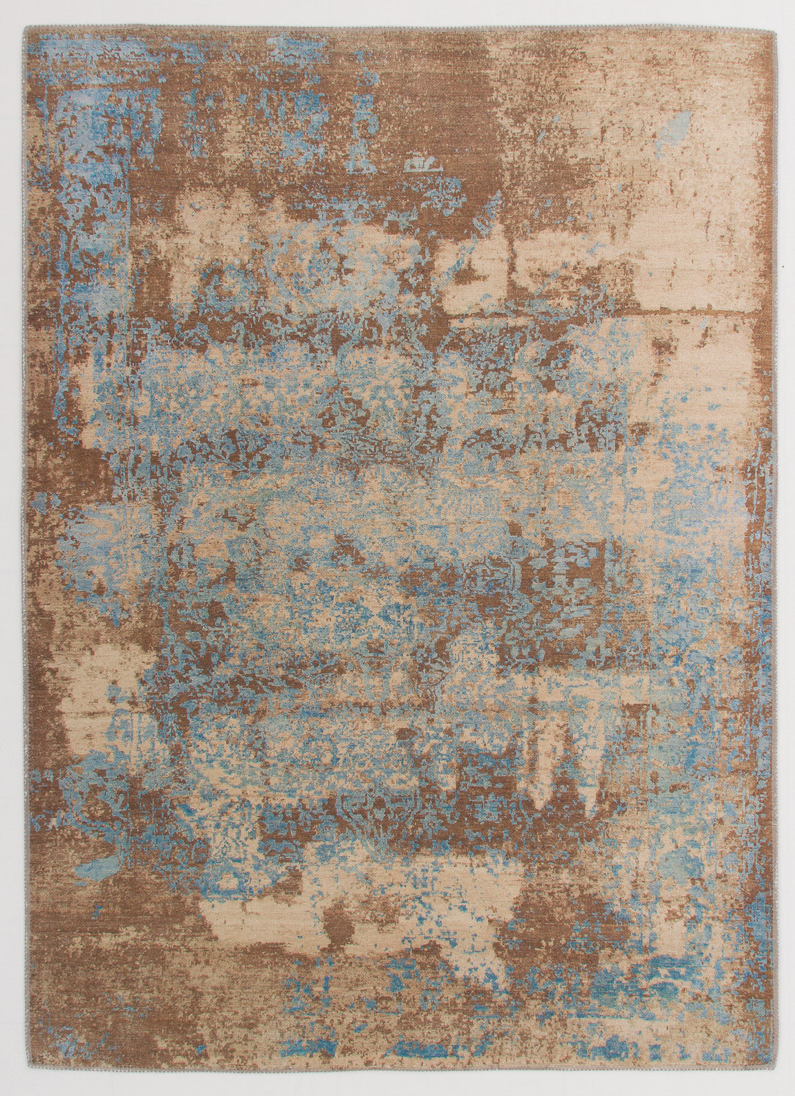 The Enchanted Threads - Washable Rug - JRS002 (Outlet) US is a flat weave rectangular rug featuring an abstract, distressed pattern in beige, bronze, brown, and light blue for a vintage look.