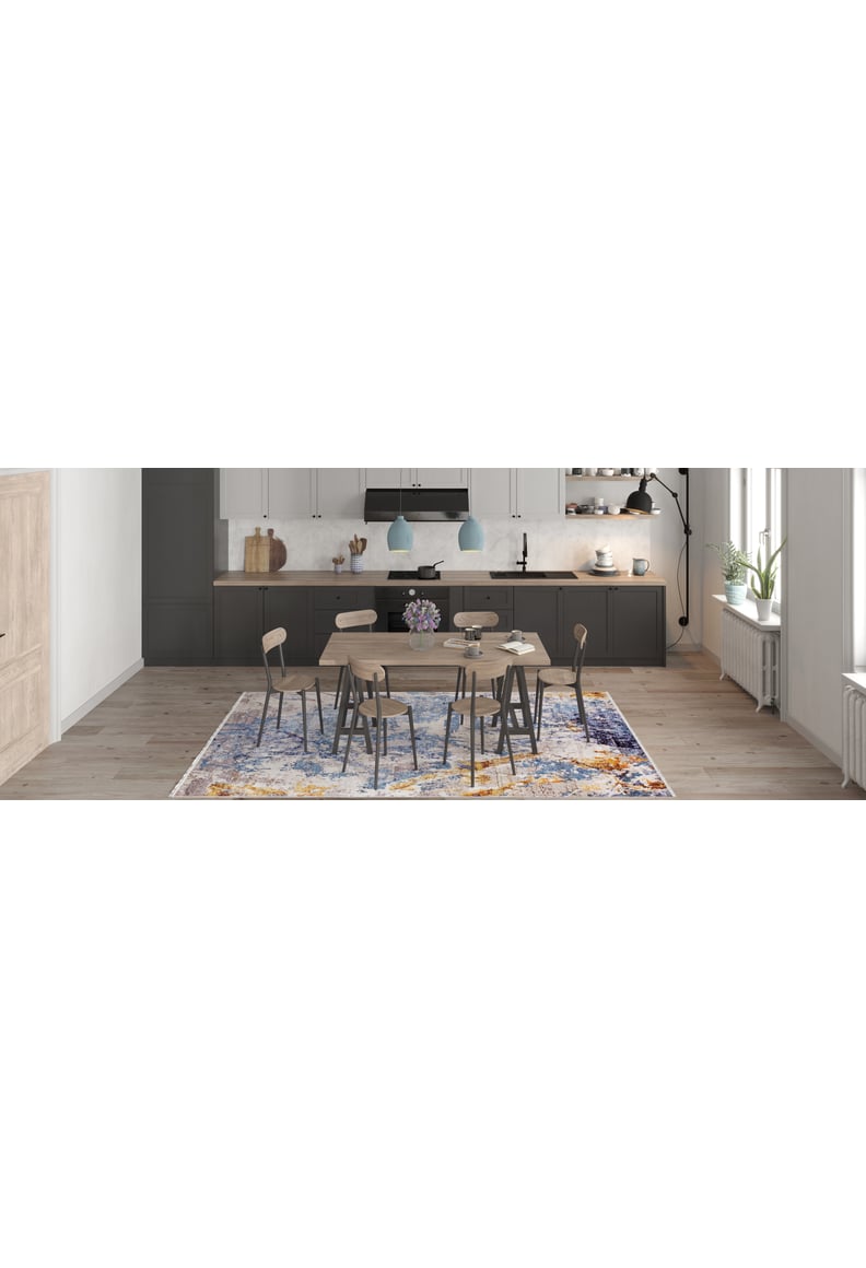 Modern kitchen and dining area with a wooden table, six chairs, pendant lights, and the Enigmatic Elegance - Washable Rug - JR787 (Custom Size)—perfect for high-traffic areas. Features dark lower cabinets, white uppers, and large windows for natural light.