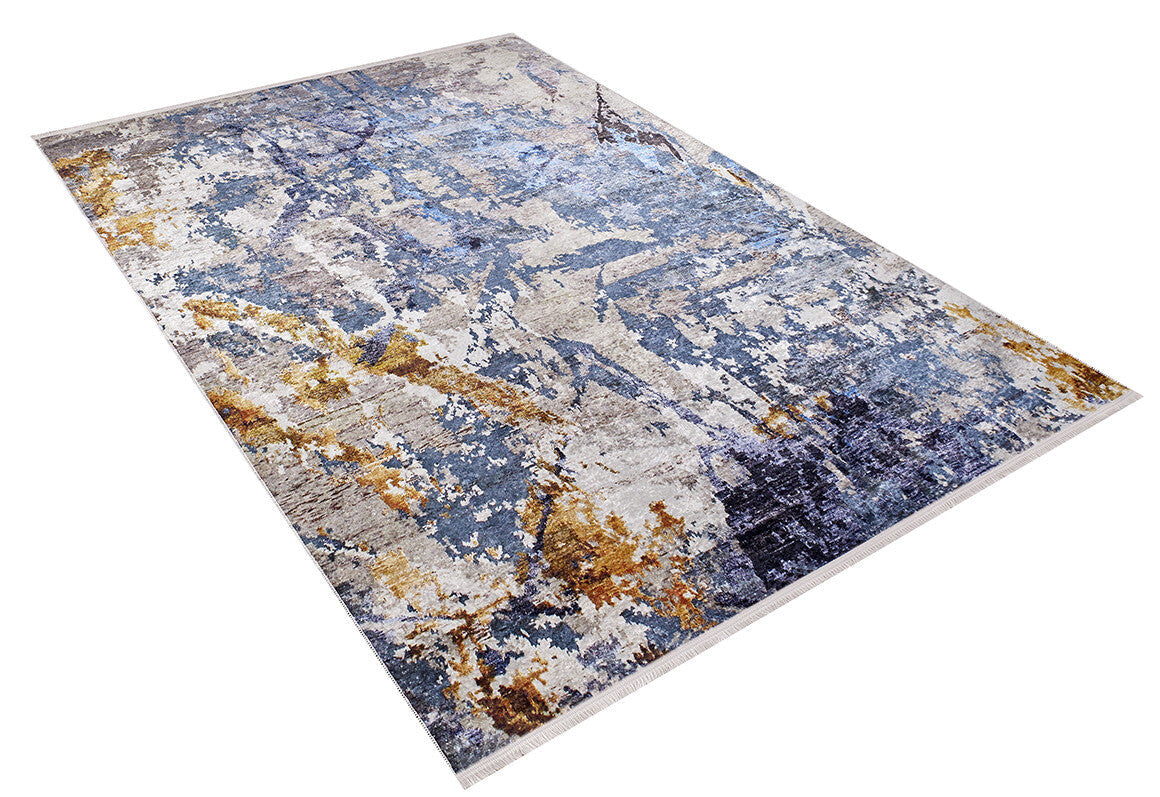 The Enigmatic Elegance - Washable Rug - JR787 (Custom Size) features a modern blue abstract design with gray, gold, and beige tones—ideal for high-traffic areas and shown angled on a white background.