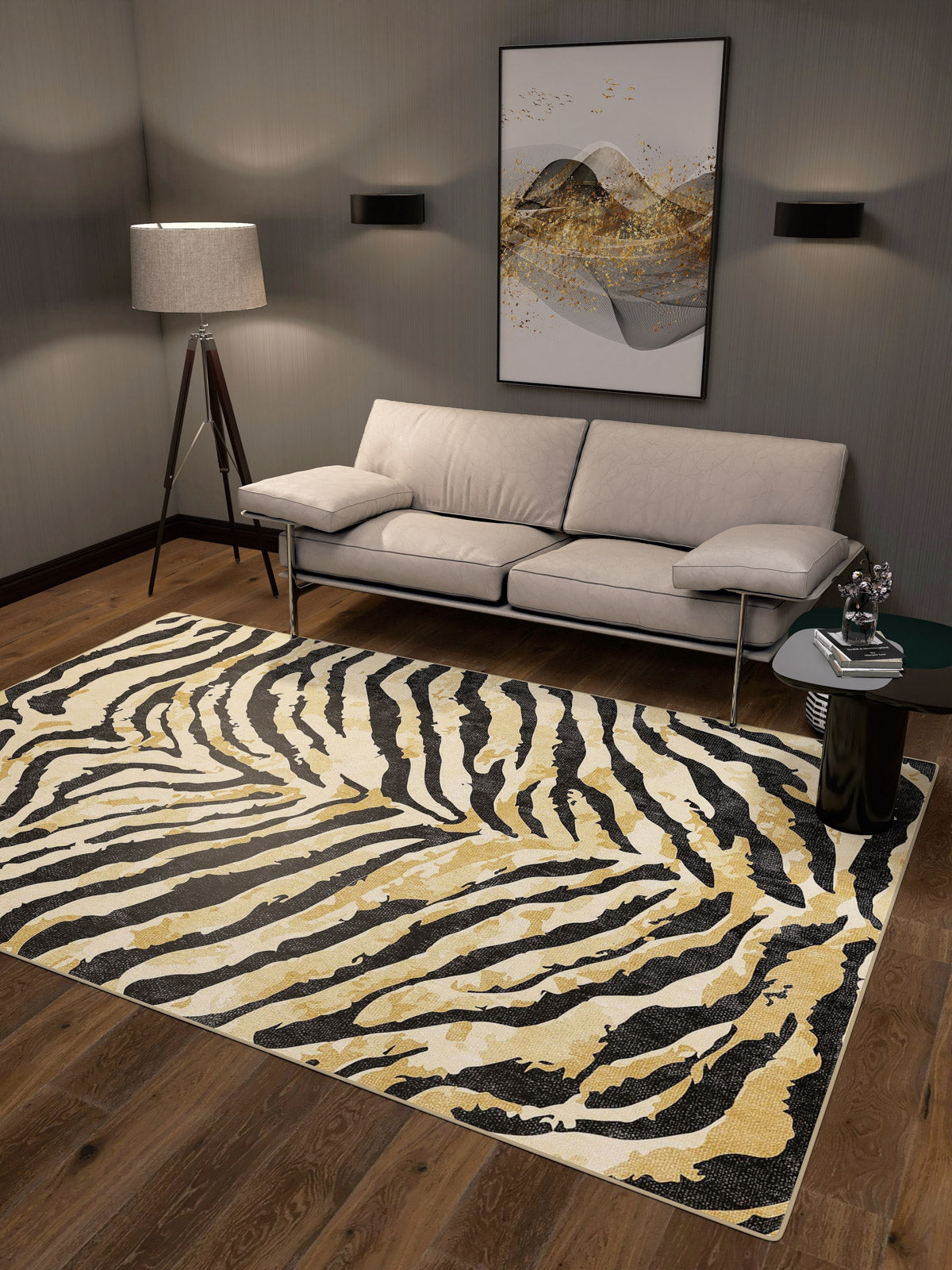 A modern living room with a beige sofa, floor lamp, abstract wall art, black side table, and the Eternal Weave - Washable Rug - JRN39 (Custom Size) in zebra stripes—stylish and ideal for high-traffic areas.