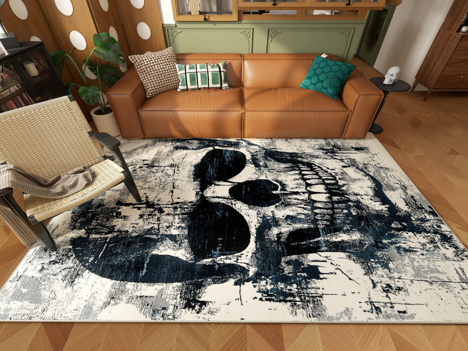 A modern living room with a brown leather sofa, green pillows, a potted plant, and a woven chair. The floor showcases the Faded Skull - Washable Rug - HLW008 featuring a bold black skull on a distressed white background.