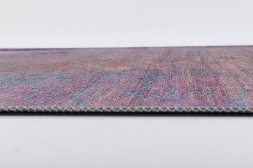 Load image 1 in gallery view. A close-up side view of the Faerie Weave - Washable Rug - JRS005 (Custom Size) highlights its multicolored design in purple, blue, and pink on a white background, with visible texture and thin edge—ideal for high-traffic areas.