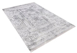 The Faint Memories - Washable Rug - JR1437 (Custom Size) features a large rectangular flat weave with a faded, intricate gray and white pattern for a vintage look. Shown angled on a white background.