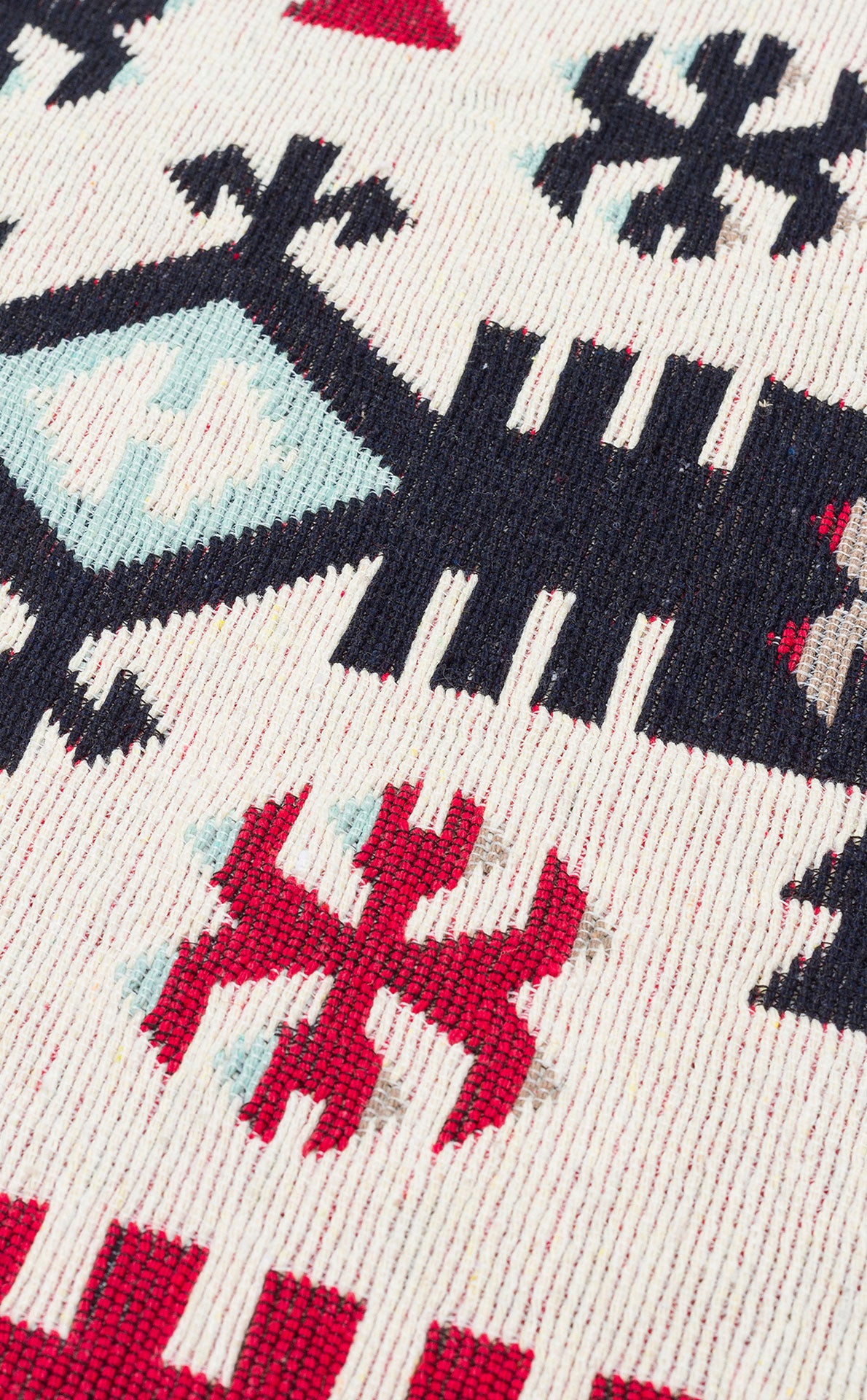 Close-up of the Flame Line - Washable Reversible Kilims - AR32 rug, showcasing a geometric, tribal-inspired pattern in red, black, and light blue on cream. This reversible rug features symmetrical motifs for a bold statement.