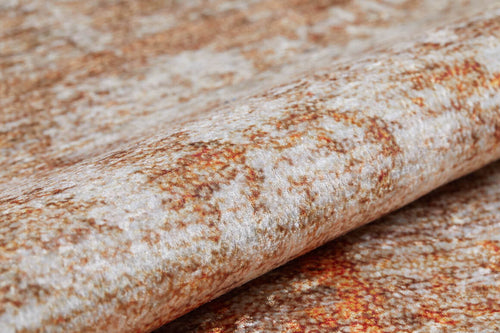 Load image 1 in gallery view. A close-up of the Fluffy Brushed - Washable Rug - JR584 (Custom Size), featuring a rolled-up, textured, mottled pattern in beige, cream, and rusty brown—ideal for high-traffic spaces.