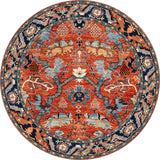 The Galea Turkish-Design Coral Washable Rug (LCC3027) is round, with intricate red, blue, gold, and cream patterns. Stylish and durable, its floral and geometric motifs make it ideal for high-traffic areas.