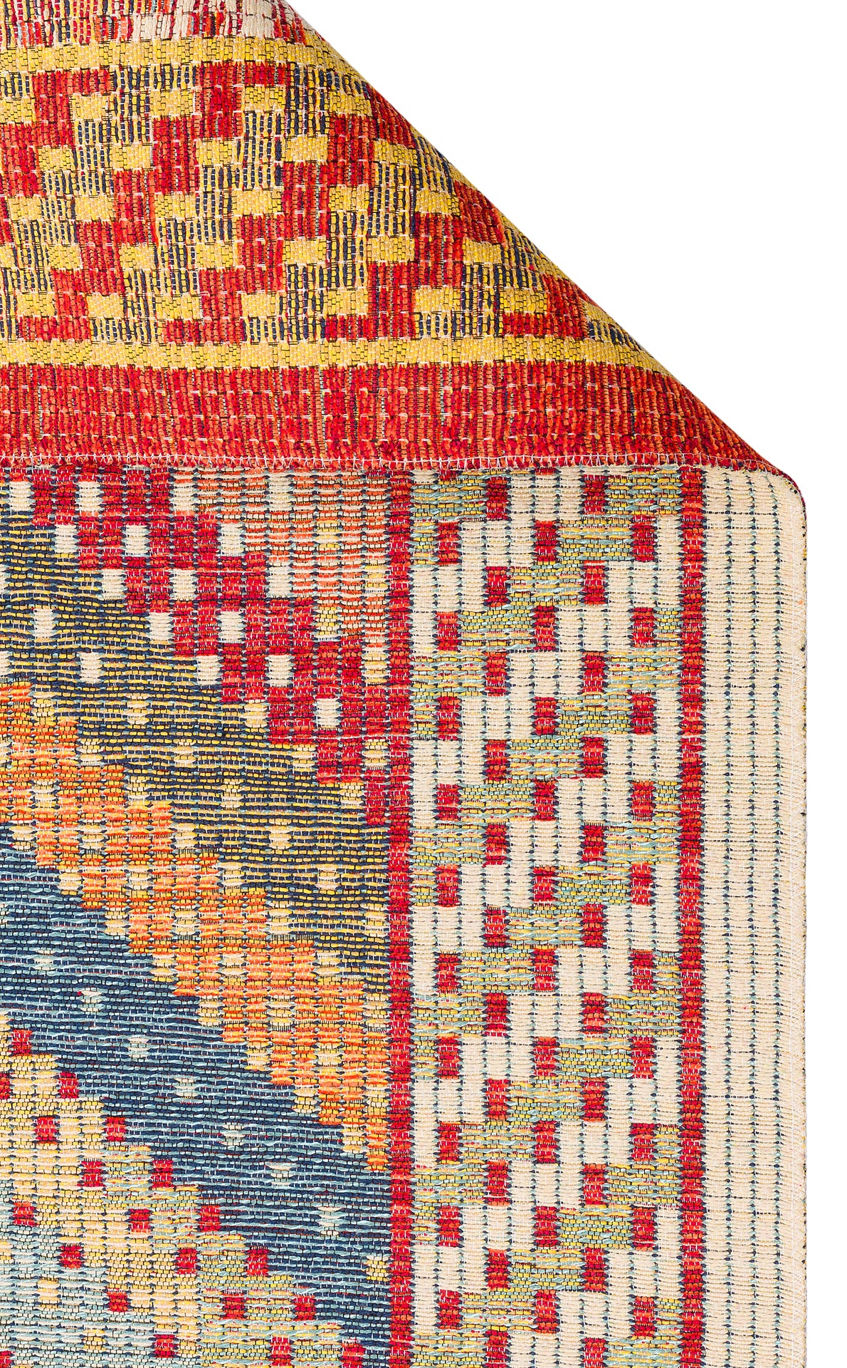 The Garnet Print - Kilim - NMD10 rug features a folded corner, showcasing its colorful low-pile polyester surface with red, yellow, blue, orange, and white geometric patterns in checkerboard and diagonal stripes.