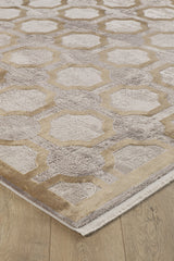 The Geometric Down Mid Century Modern Rug - M534B is a contemporary, machine-made beige and taupe rug with interlocking hexagon and octagon lattice patterns, featuring a short fringe on one edge and displayed on a light wood floor.