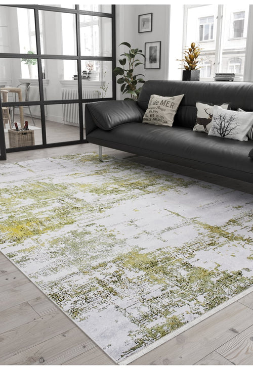 Load image 1 in gallery view. A modern living room features a black leather sofa, decorative pillows, a potted plant, and the Geometric Geometry - Washable Rug - JR1290 (Custom Size), showcasing white abstract patterns—ideal for high-traffic areas with abundant natural light.