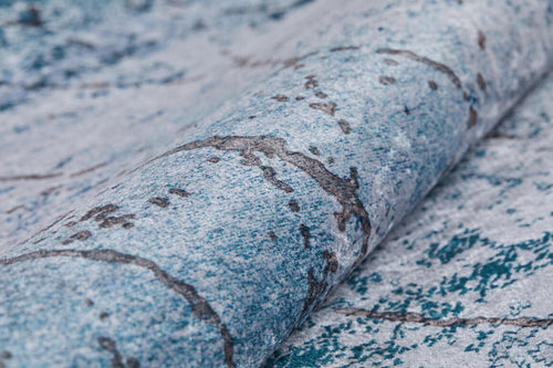 Load image 1 in gallery view. A close-up of blue and gray marbled wallpaper with dark, stone-like lines—ideal for pairing with the Geometric Glimmers - Washable Rug - JR1423 (Custom Size) in busy spaces.