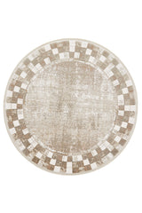The Geometric Latte Premium Rug - M420G is a round, machine-made rug featuring a beige and cream checkerboard border and a distressed center in shades of beige and tan, ideal for bringing minimalist style to any room.