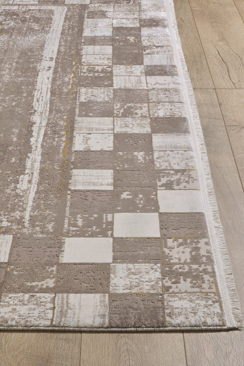 Load image 1 in gallery view. A close-up of the Geometric Latte Premium Rug - M420G shows its beige and cream checkered border on a light wooden floor. This machine-made rug blends textured and smooth surfaces for a chic, minimalist style.