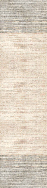 The Gilded Charm - Washable Rug - JRN26 is a rectangular flat weave rug with a minimalist look, featuring a light beige center and thick textured gray borders. Its washable design has a subtle woven pattern throughout.