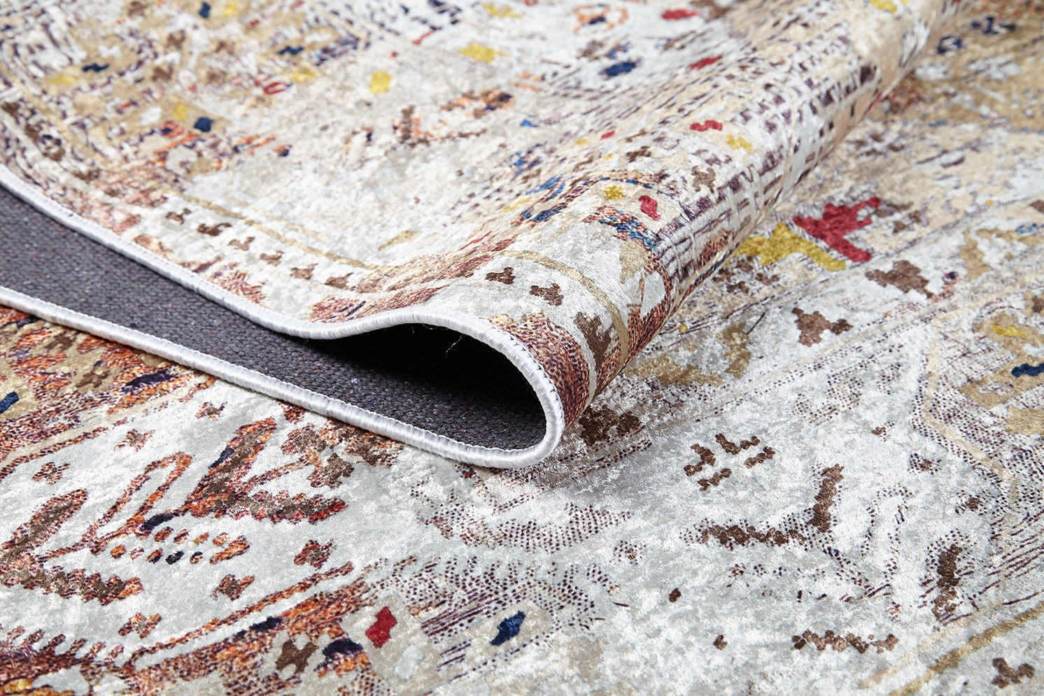 A close-up of the Global Getaway - Washable Rug - JR1667 (Custom Size), featuring neutral cream and beige tones with hints of red, yellow, and blue; its flat weave design is ideal for those seeking textured, stylish washable rugs.