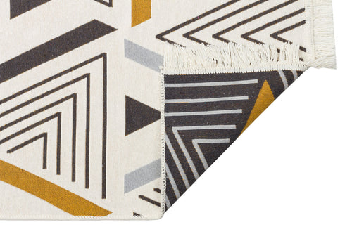 Load image 1 in gallery view. Golden Fog - Washable Double-Sided Kilims - AR18 features black, gold, and gray geometric patterns on a cream background. Made from recycled cotton, this fringed rug is double-sided and machine washable.