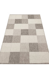 Grey Fold - Kilim - MNO01 is a flatwoven polyester rug with a modern checkerboard pattern in beige, brown, and cream squares. Its geometric design and varied textures add a stylish, contemporary touch to any room.