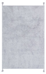 The Grey Snug - Washable Shaggy - CBNPLAIN is a large, rectangular grey cotton rug with a soft, plush texture and tassels at each corner. Its plain design with no patterns suits any modern bedroom and it's easy to wash.