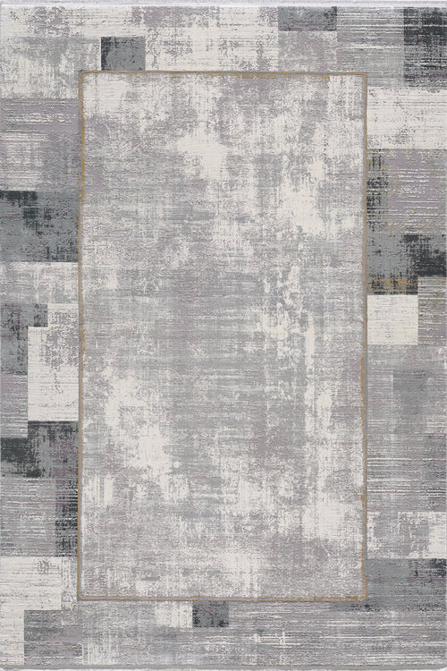 Load image 1 in gallery view. The GridWave Silver Premium Rug - M426A is a modern machine-made piece with a distressed abstract patchwork in shades of gray, white, and black, highlighted by a subtle golden rectangle near the center.