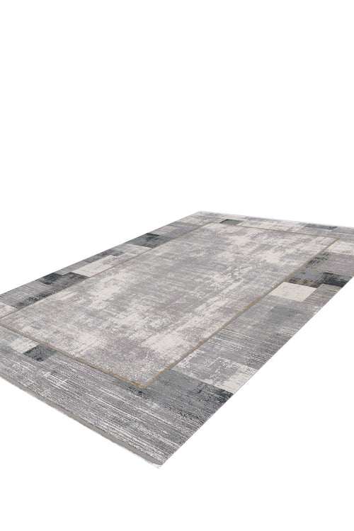 Load image 1 in gallery view. The GridWave Silver Premium Rug - M426A is a rectangular, machine-made rug with a minimalist gray distressed pattern, lighter and darker blocks, and a subtle border. Modern in style, it's shown on a white background.