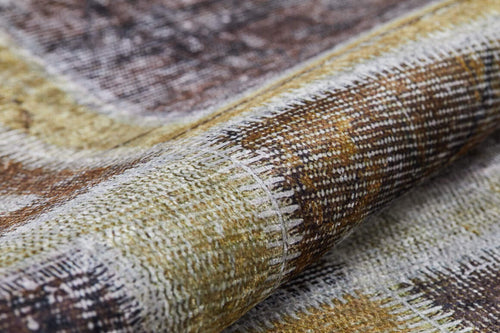 Load image 1 in gallery view. A close-up of the Gridiron Glow - Washable Rug - JR183 (Custom Size), showcasing its earthy yellow, bronze, and brown woven pattern, detailed stitching, and durable fibers—ideal for high-traffic areas.