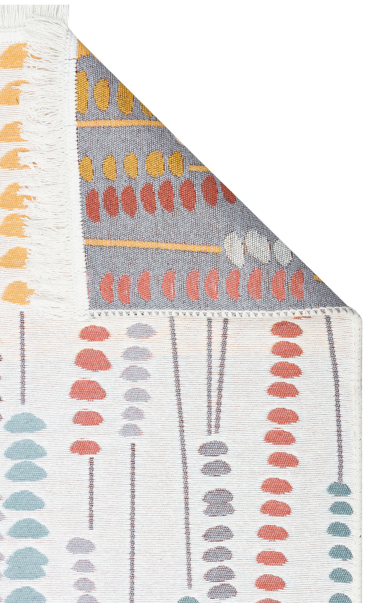 A close-up of the Harmony Weave - Washable Reversible Kilims - AR34 rug shows colorful abstract leaf shapes in red, orange, yellow, and gray on a white background, with the corner folded to display its fringe edge and reversible side.