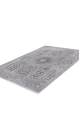 The Hidden Treasures Turkish Rug - Smoky - 2223C is a rectangular machine-made rug featuring an intricate traditional pattern in muted blue, gray, and beige tones, shown on a white background.