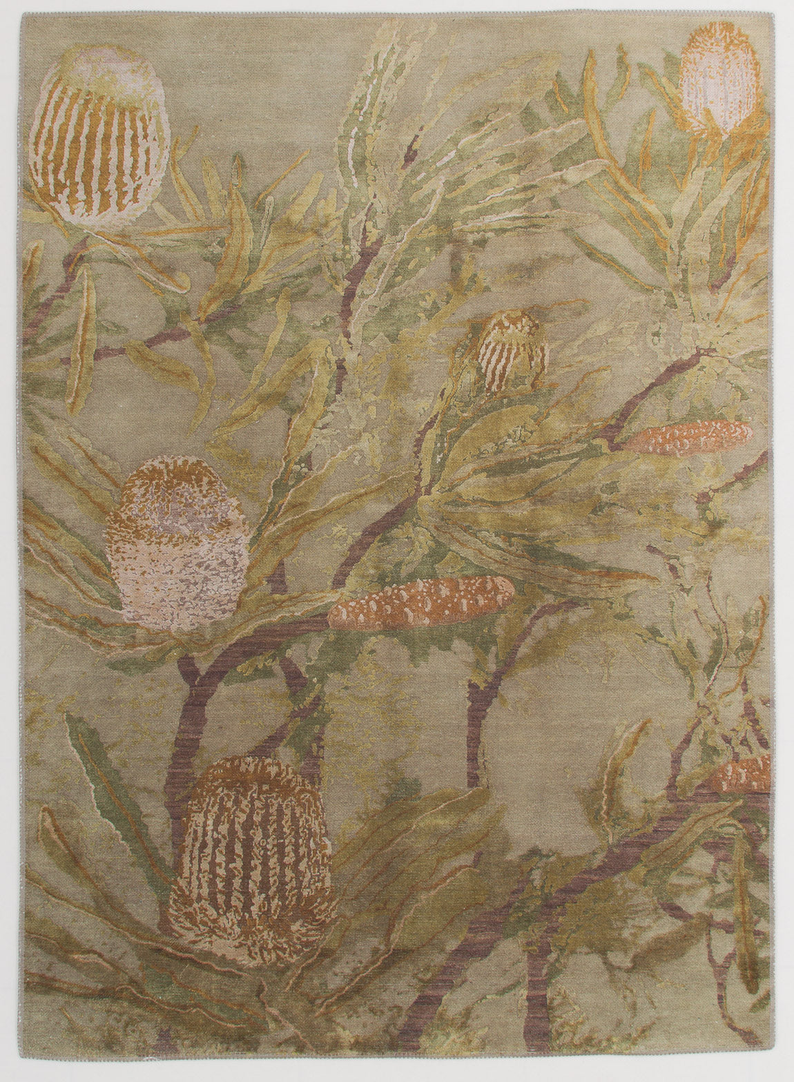 The Dreamweaver's Loom - Washable Rug - JRS001 features a flat weave with large, stylized banksia flowers and slender green leaves on an earthy background in soft greens, browns, and pinkish-beige—perfect for any space.