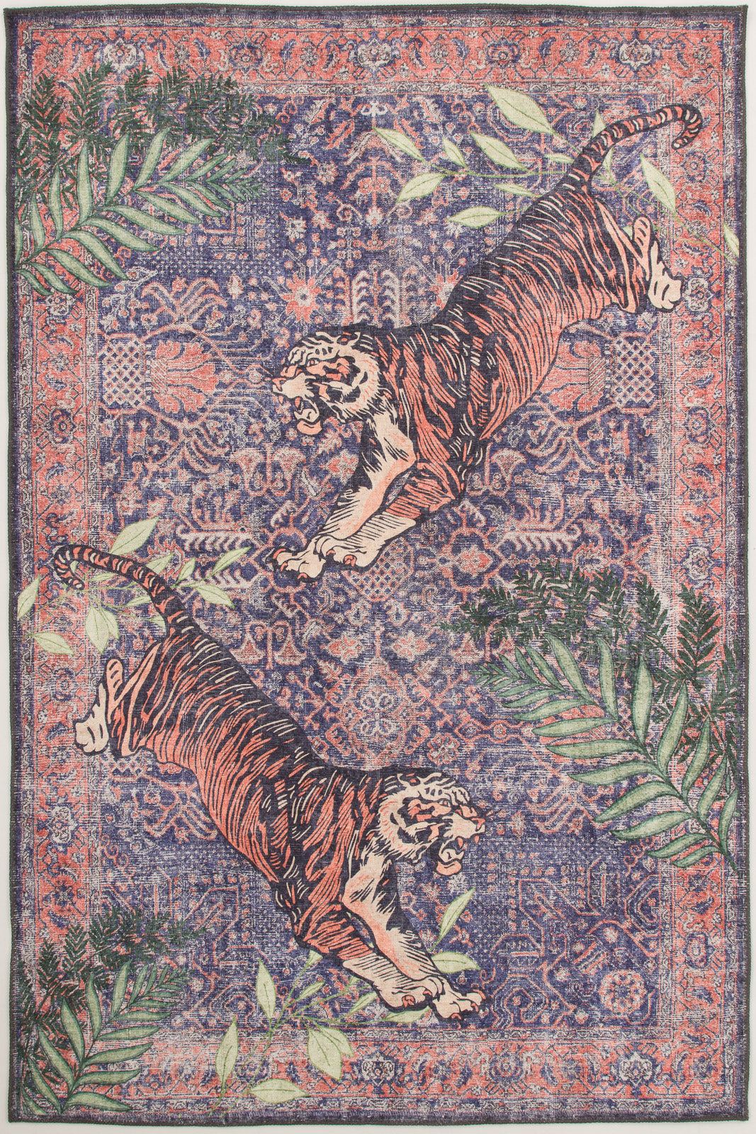 The Stormstripe Echo - Washable Rug - JR0046 showcases two orange tigers facing each other on a blue background, framed by leafy green plants, making it a bold and contemporary geometric rug for any space.