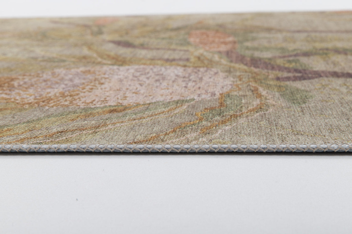 Close-up of Dreamweaver's Loom - Washable Rug - JRS001 (Custom Size) in muted earth tones, featuring a flat, thin profile and detailed stitched border—perfect for high-traffic areas, shown on a smooth white surface.