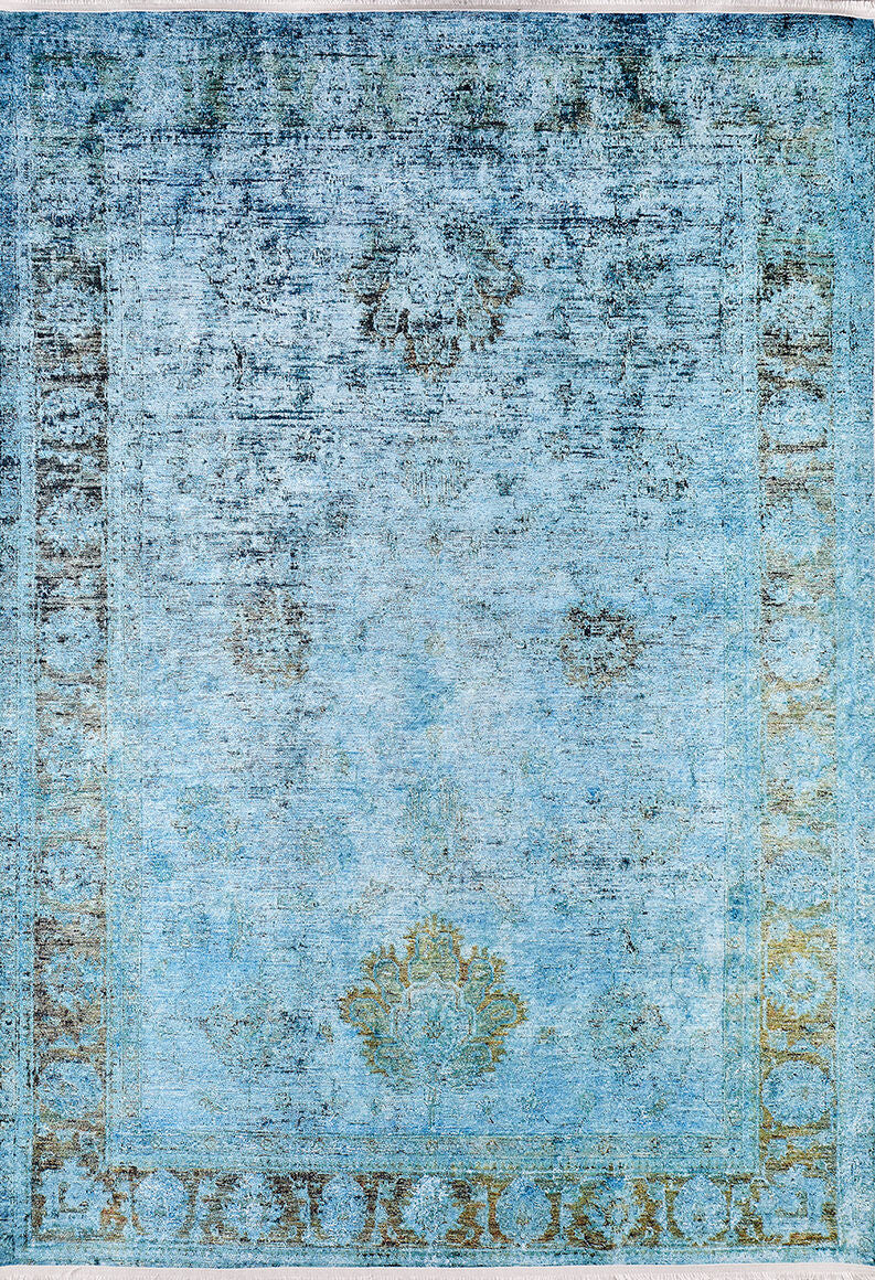 The Imperial Jewel - Washable Rug - JR162 (Custom Size) features a faded blue vintage design with a subtle medallion and decorative border. Its worn texture and muted colors create an antique look, perfect for allergy-sensitive homes.