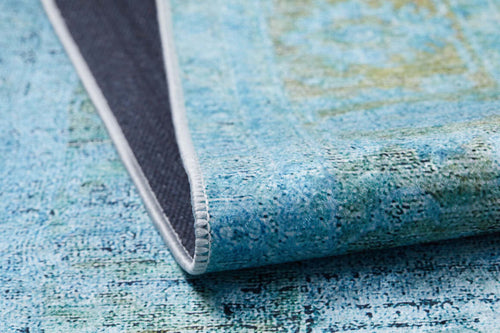 Load image 1 in gallery view. A close-up of the Imperial Jewel - Washable Rug - JR162 (Custom Size) in blue and green, showing its textured surface, stitching, and dark backing. This washable rug is perfect for allergy-sensitive homes.