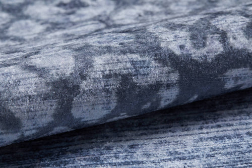 Load image 1 in gallery view. Close-up of the Intricate Scroll - Washable Rug - JR342 (Custom Size) featuring a soft, textured surface with blue and gray abstract scrolls; its fold highlights subtle color variations—perfect for allergy-sensitive homes.