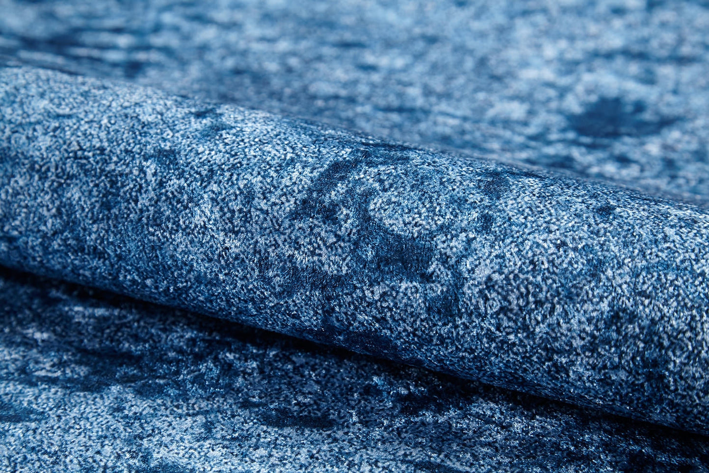 A close-up view of the Ivory Whisper - Washable Rug - JR1628 (Custom Size) shows its mottled, velvety blue pattern—perfect for high-traffic areas and easy to maintain.