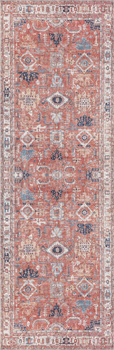 The Mystral Kilim-Design Coral Washable Rug - LCC3015 is a rectangular, Persian-style rug with geometric patterns in rust red, blue, beige, and ivory. Ideal for high-traffic areas, it features a detailed border and symmetrical central motifs.