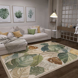 A cozy living room with a white sofa, green and yellow cushions, the Amazon Veil - Washable Rug - JRS010 in a leafy pattern—ideal for busy areas—botanical wall art, a standing lamp, and modern decor in warm earthy tones.