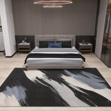 A modern bedroom with a gray upholstered bed, black and white bedding, nightstands, and the Shadow Flow - Washable Rug - JRS011 in black, white, and gray on light wood floors—ideal for high-traffic areas. A circular ceiling light is above the bed.