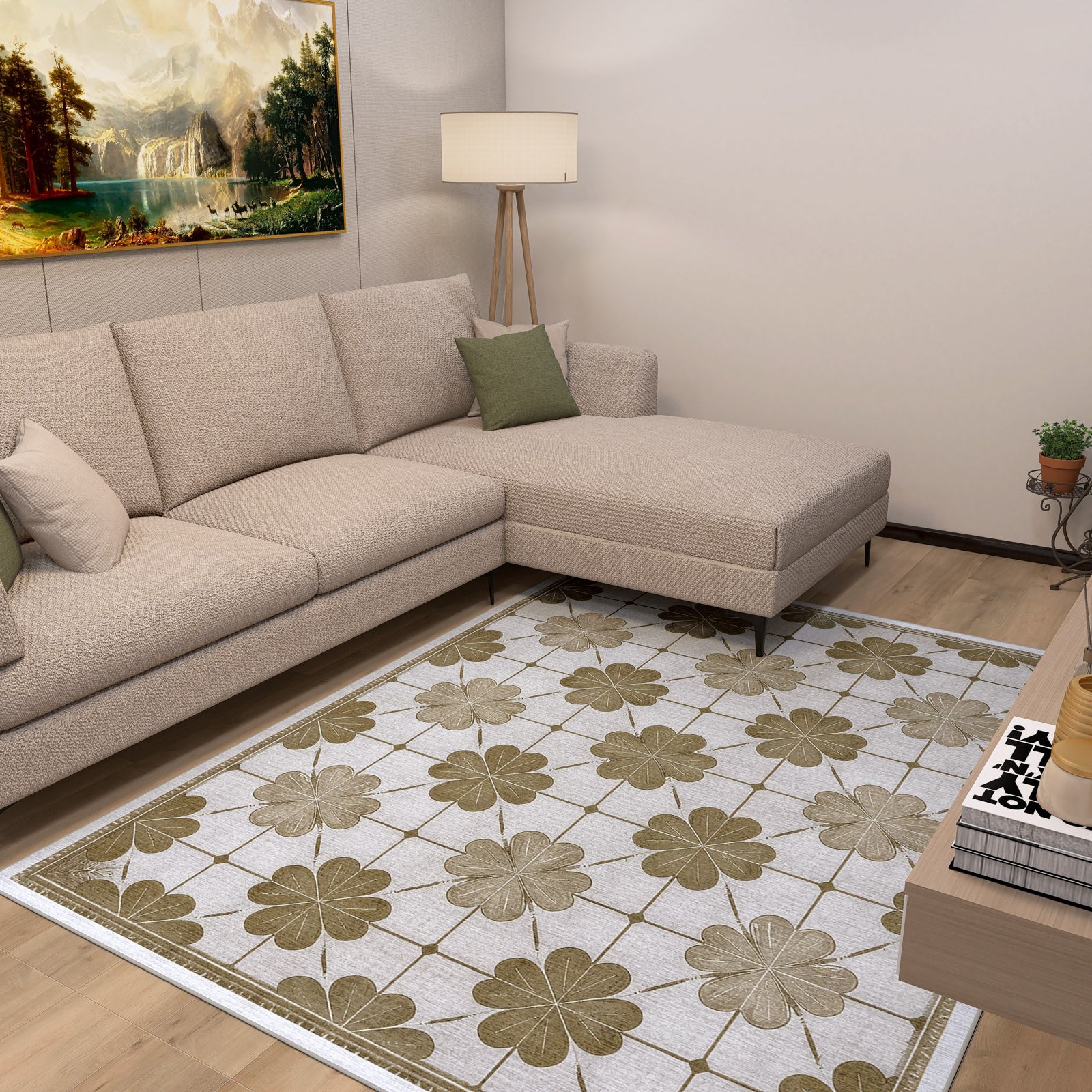 A modern living room features a beige sectional sofa with green pillows, a floor lamp, landscape painting, and the Ivory Clover - Washable Rug - JRS014 with a large green and brown floral design—perfect for high-traffic areas. A small plant sits in the corner.