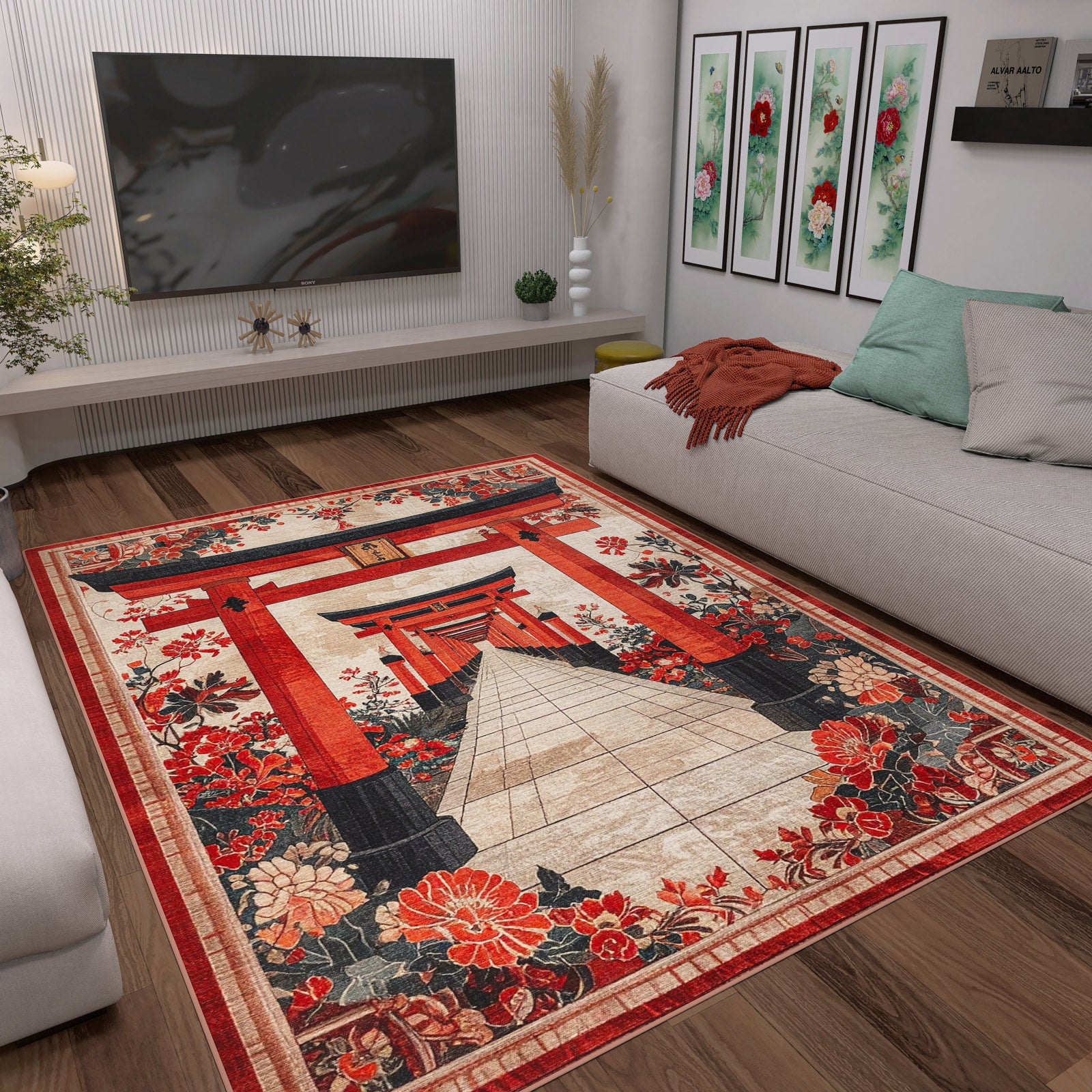 A modern living room with light gray sofas, colorful cushions, and the Crimson Gate - Washable Rug - JRS020 featuring a Japanese torii gate and floral patterns. Floral artwork decorates the wall above the sofa.