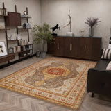 A modern living room showcases the Amber Stone - Washable Rug - JRS026 with geometric patterns, paired with wooden furniture, a sofa, bookshelves, a plant, and decorative sculptures on a sideboard—ideal for contemporary spaces.