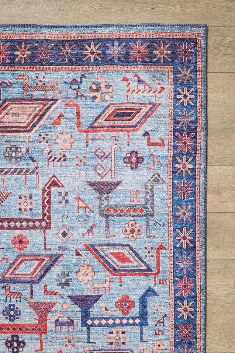 The Birdwatcher's Dream Blue Washable Rug - LCC3020 (Custom Size) features colorful geometric and animal patterns in blue, red, pink, and cream with a detailed border—ideal for high-traffic spaces and easy to clean.
