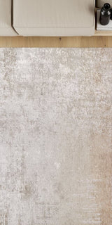 Close-up of a textured beige rug with a neutral color palette.