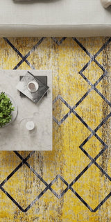 Yellow and black patterned rug with a coffee table and decor items