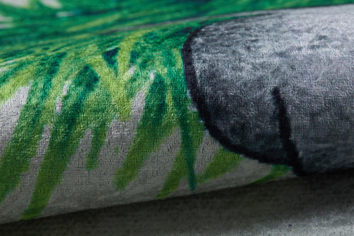 Load image 1 in gallery view. Close-up of the Joyful Elephant - Machine-Washable Rug JRC026 (Custom Size), showing its allergy-friendly flat weave, green grass-like patterns, and a rounded gray shape that highlights its unique printed design and texture.