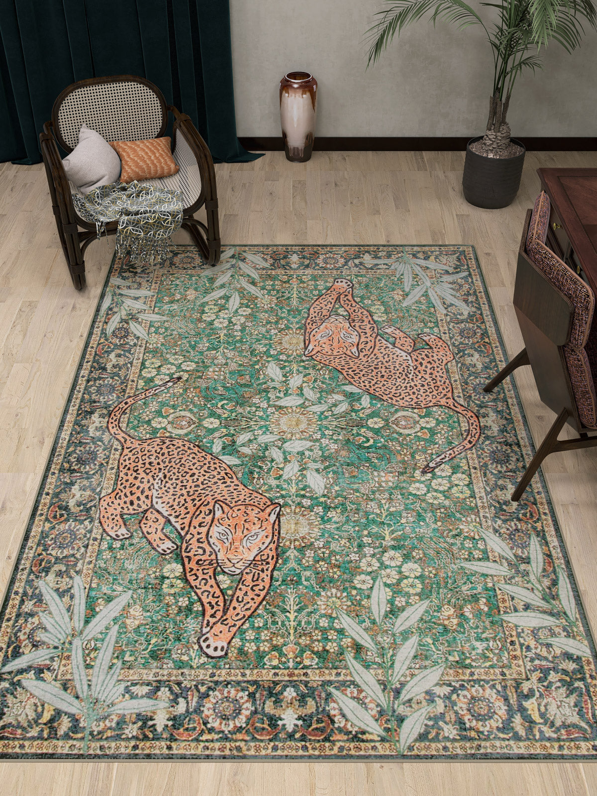 A room featuring the Jungle Ember - Washable Rug - JR0047, a green area rug with two leopards on a floral and leafy backdrop. Nearby are a woven chair, potted plant, brown vase, and a wooden table with chairs.