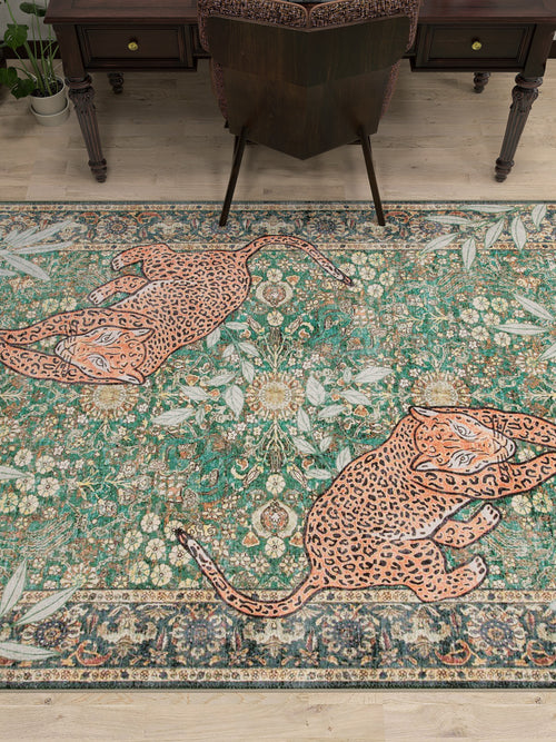 Bild 1 in Galerieansicht laden. The Jungle Ember - Washable Rug - JR0047, featuring an ornate floral pattern and two large leopards, adds a decorative touch under a desk and chair on a wooden floor.