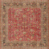 The Legacy Wreath - Washable Rug (JRN1024) features a rich red background with intricate gold and brown floral and vine patterns, complemented by a detailed, multicolored border with symmetrical designs.