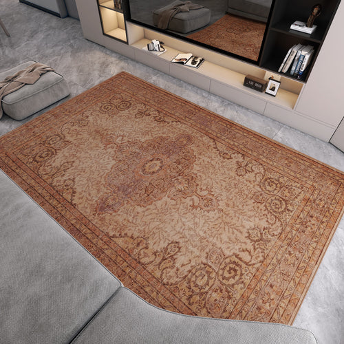 Load image 1 in gallery view. A living room featuring the Chateau Elegance - Washable Rug - JRN1018 (Custom Size) with light brown borders on a gray marble floor, paired with a gray sectional, modern shelving, and a large mirror reflecting the stylish decor.
